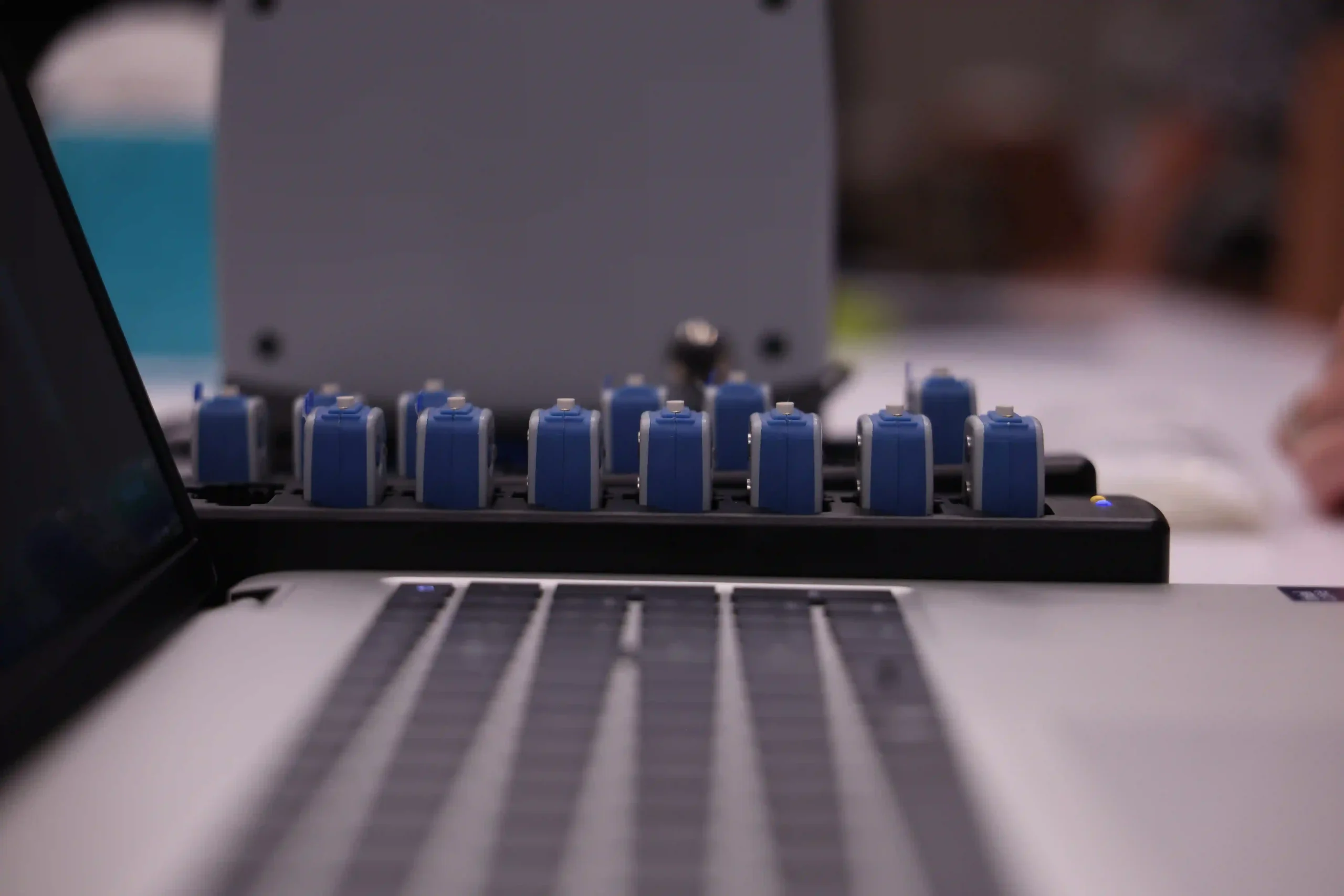 Portable EFA sensor cradle behind a laptop keyboard